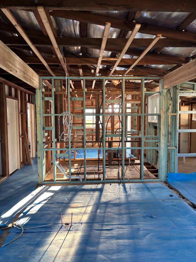 Khaki Plumbing technician performing renovation plumbing in Brisbane Northside