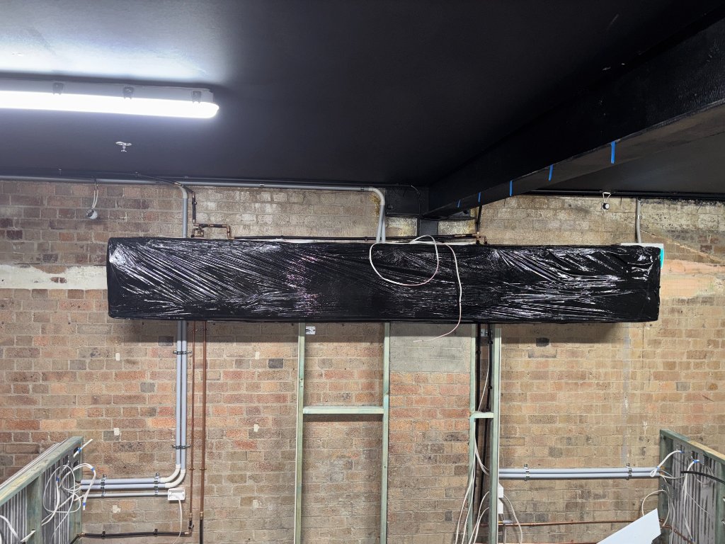 Khaki Plumbing technician performing new plumbing installations in Brisbane Northside