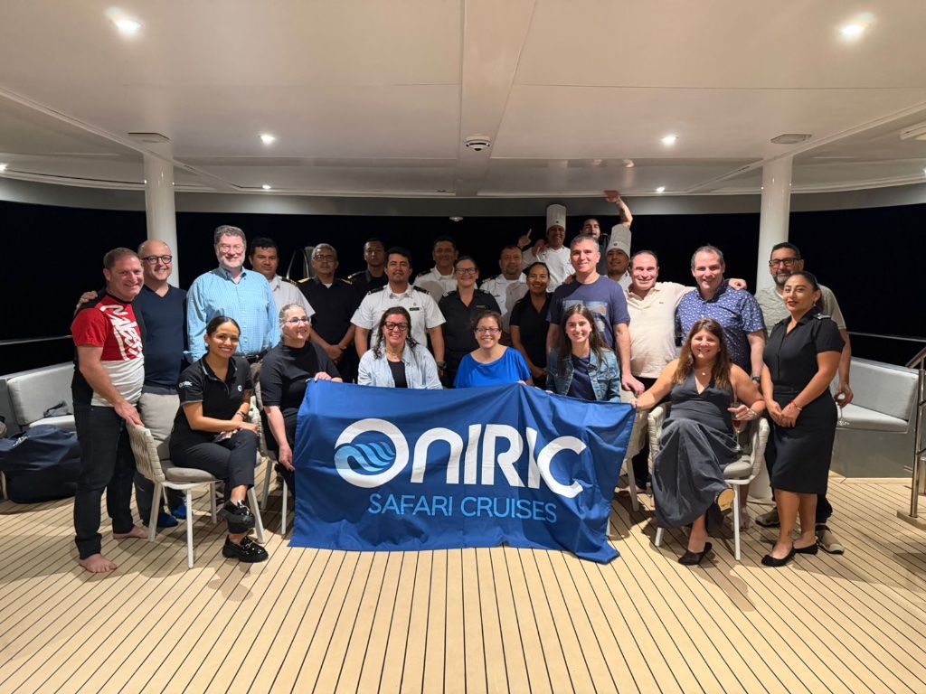Real KPG group and crew together on a Galápagos yacht deck