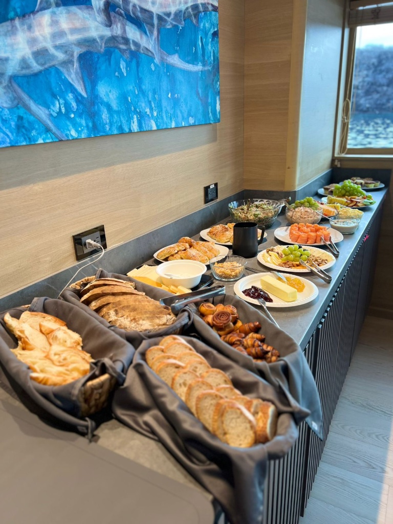 Full kosher breakfast buffet spread with ocean view on luxury Galápagos yacht