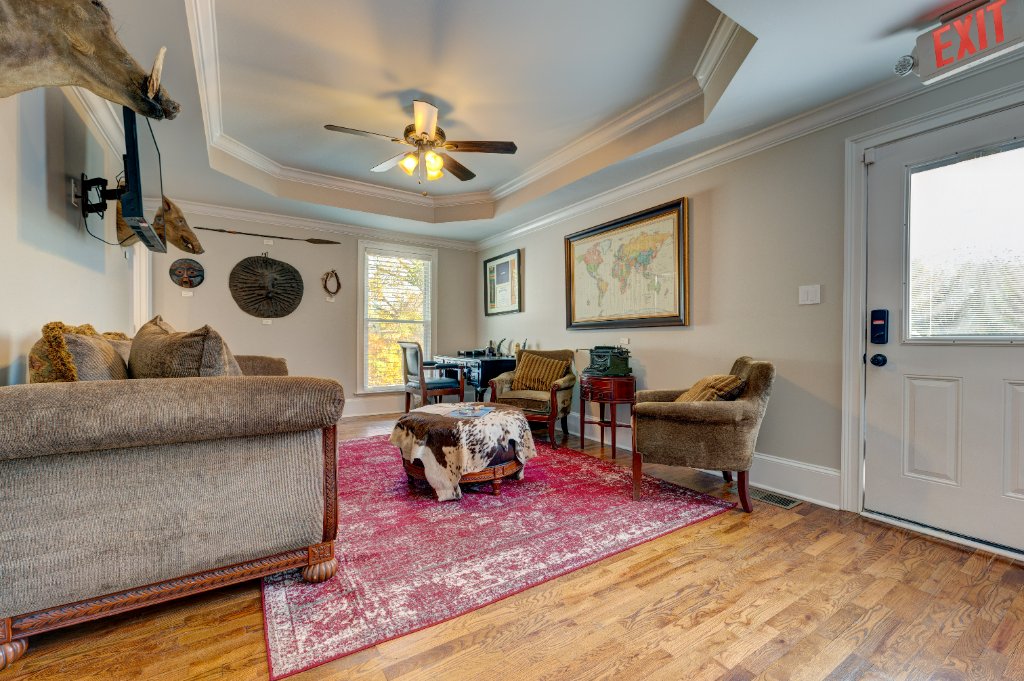 Professional office space with tray ceilings and vintage hardwood floors