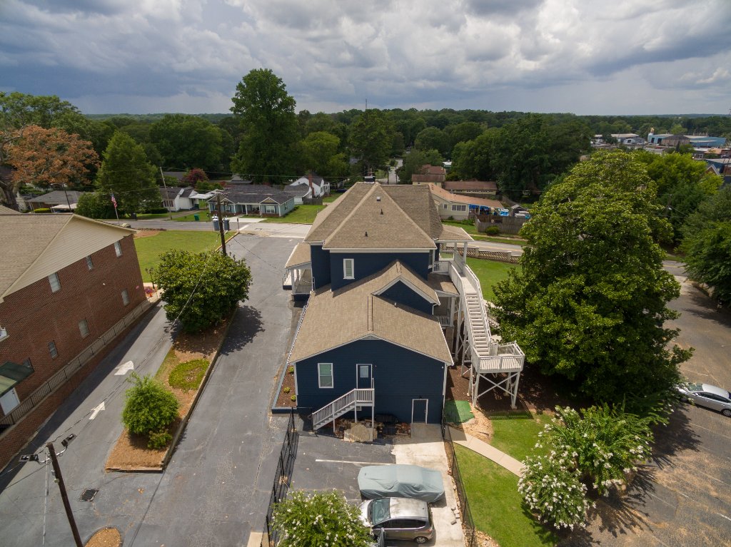 Historic Austell House rear aerial view showing back porch and parking area Austell Georgia Victorian property