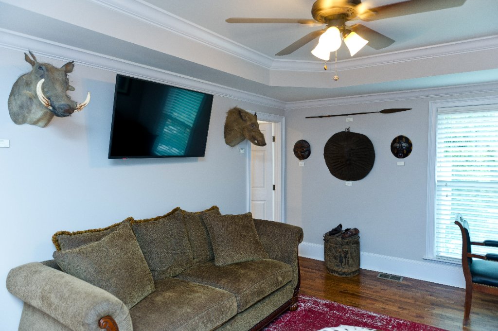 Office space with trophy heads and eclectic decor blending old and new