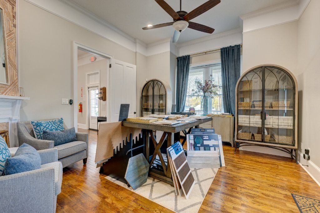 Professional workspace with arched display cabinets and natural light