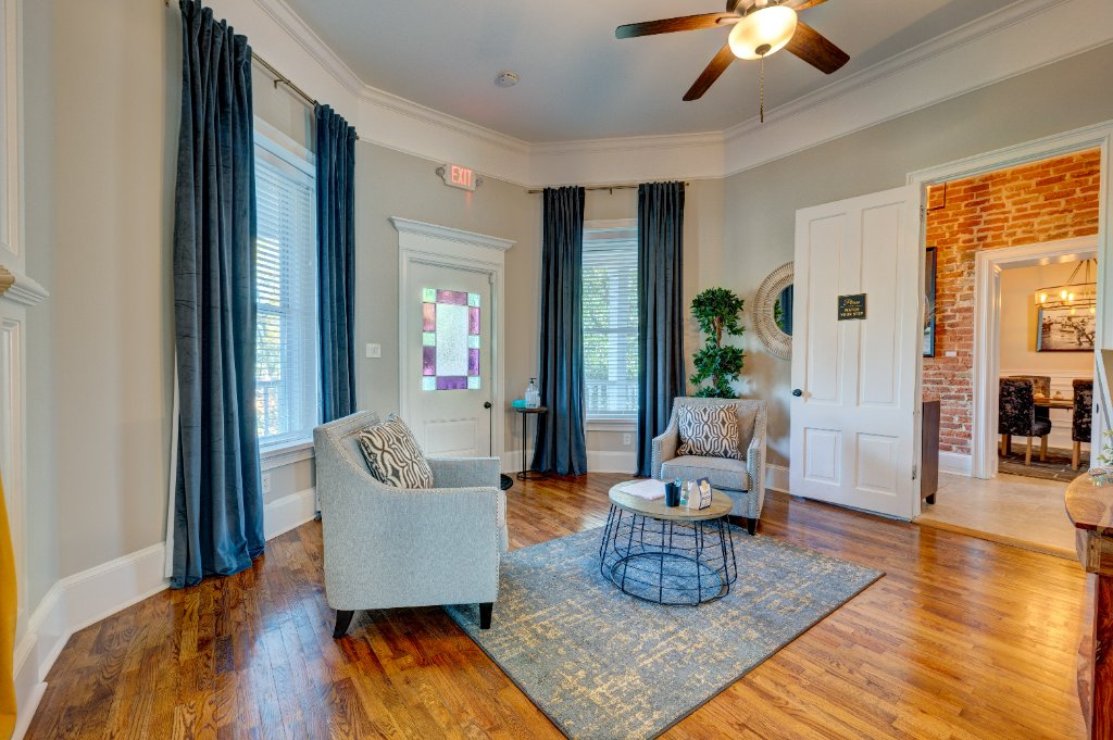 Elegant reception area with stained glass and exposed brick archway