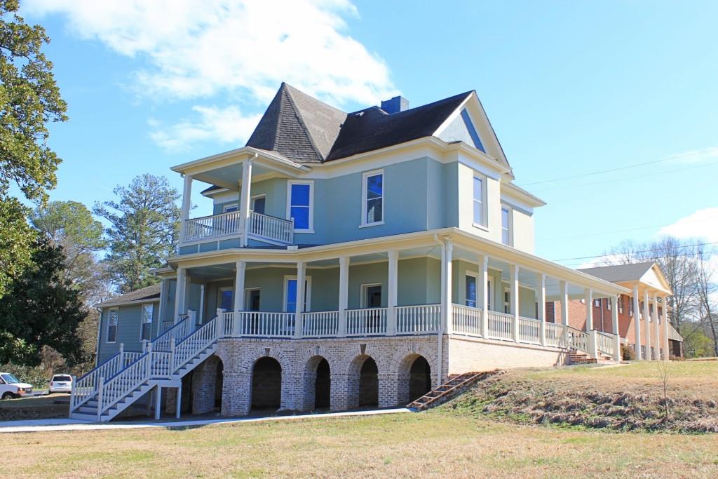 Fully restored Historic Austell House with brick arches and wraparound porches