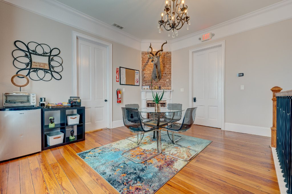Modern conference room with exposed brick and crystal chandelier