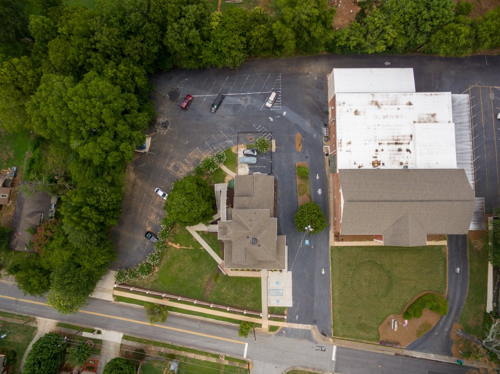 Historic Austell House aerial photography showing full grounds and neighboring properties Austell GA downtown area