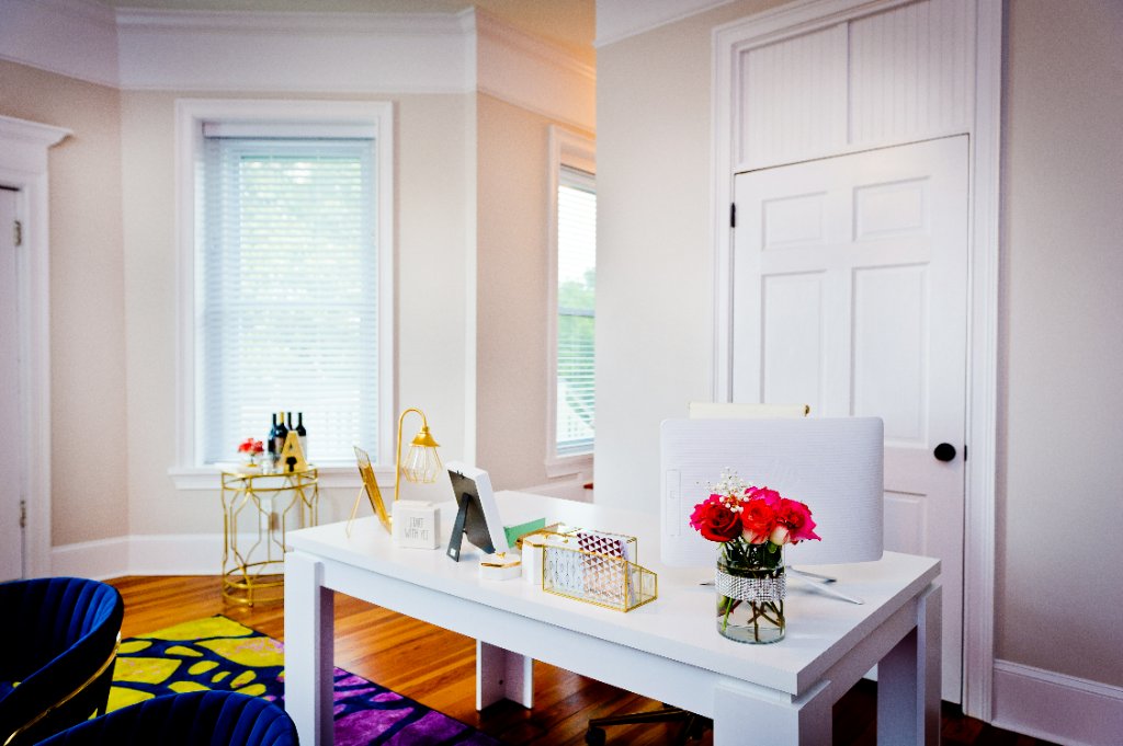 Professional office space with modern furnishings and historic hardwood floors