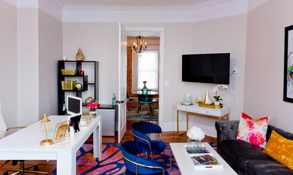 Contemporary office with vibrant decor and original architectural details