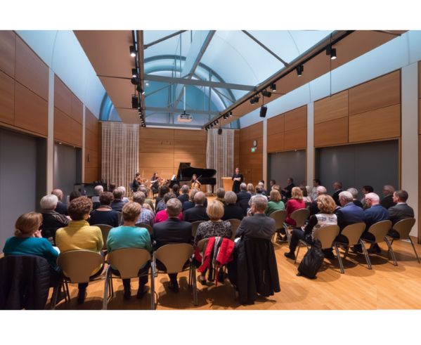 Intimate chamber music concert — audience seated for a live performance