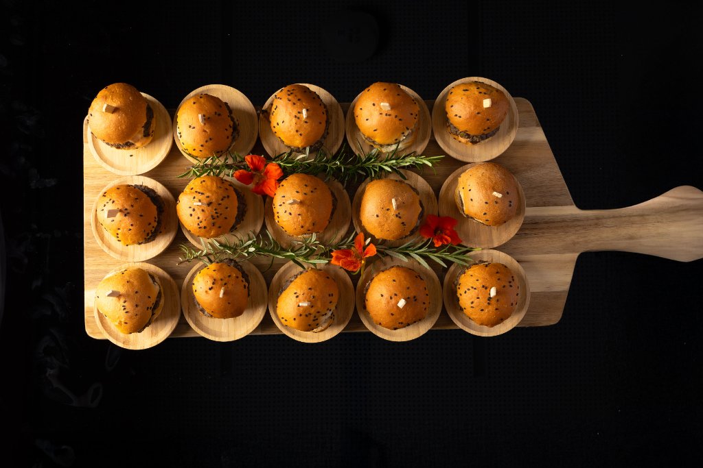 Sausage rolls on timber boards