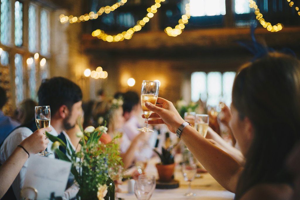 Wedding guests raising champagne glasses