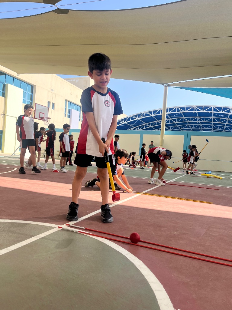 Child practicing chipping skills