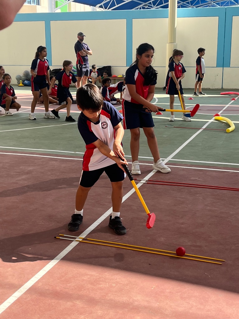 Students learning golf techniques