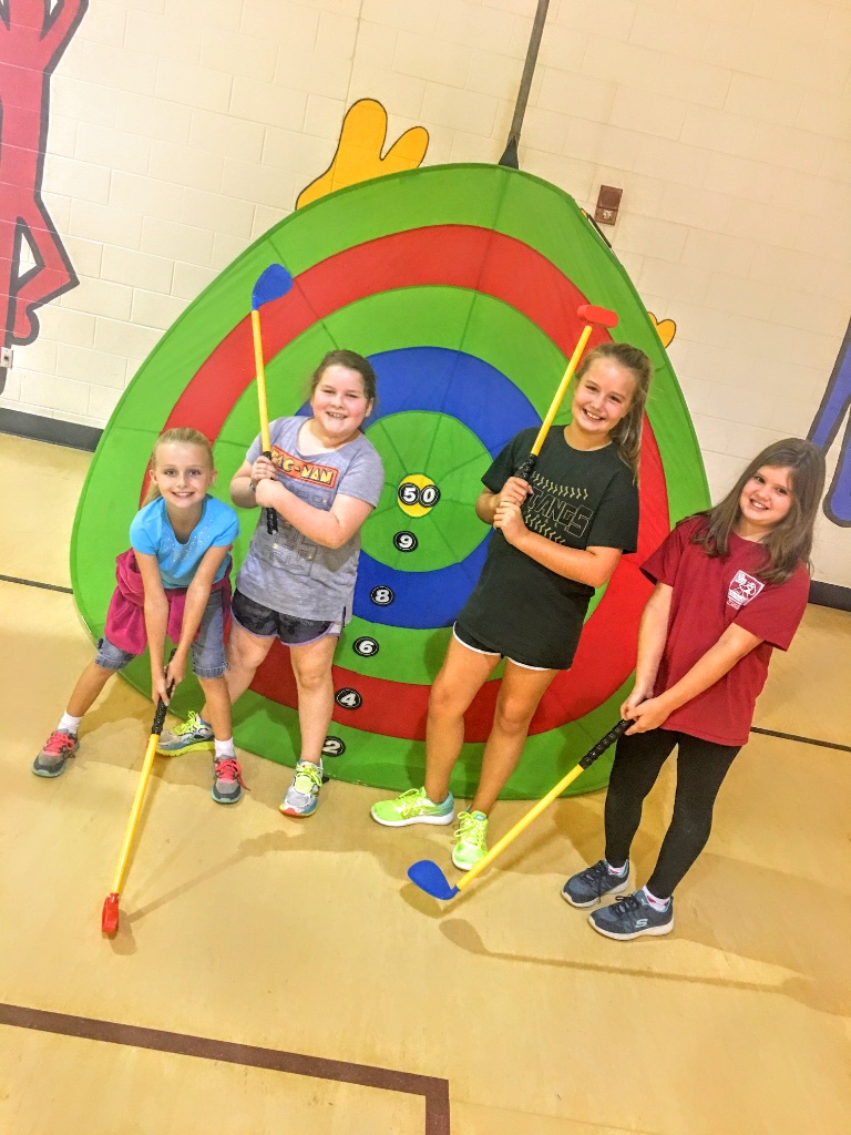 Happy kids with plastic clubs