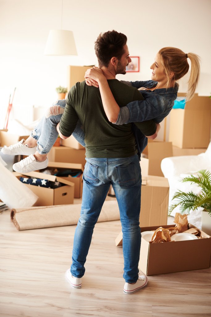 Happy couple moving into new home