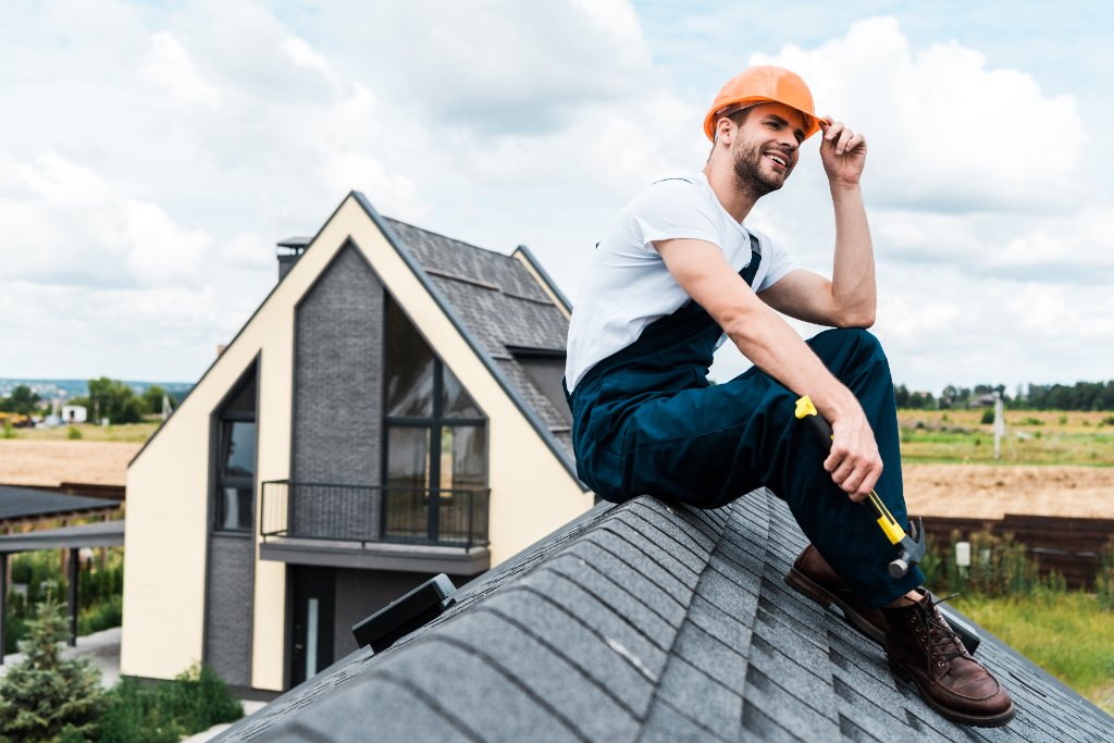 Roofing company worker on roof