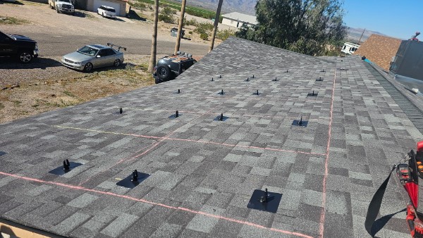 Mounting feet installed on new shingles