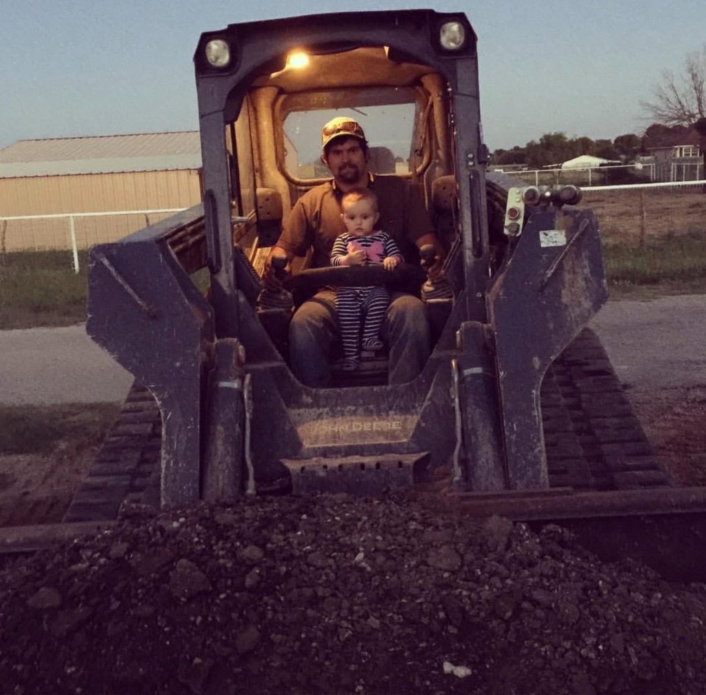 Reece Albert on equipment with family