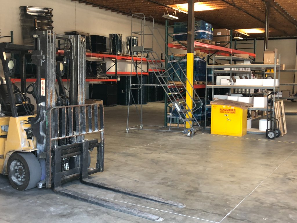 Pump warehouse with forklift and storage racks