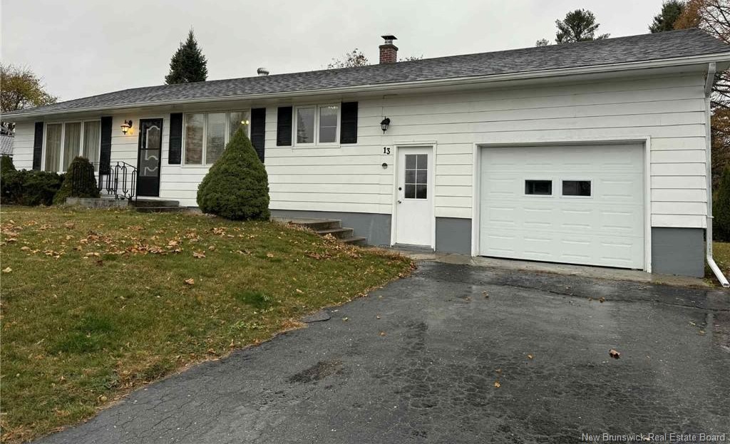 New Brunswick home with attached garage and overhead door