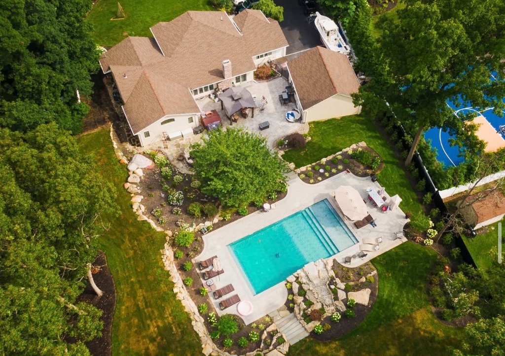 Aerial estate pool with house