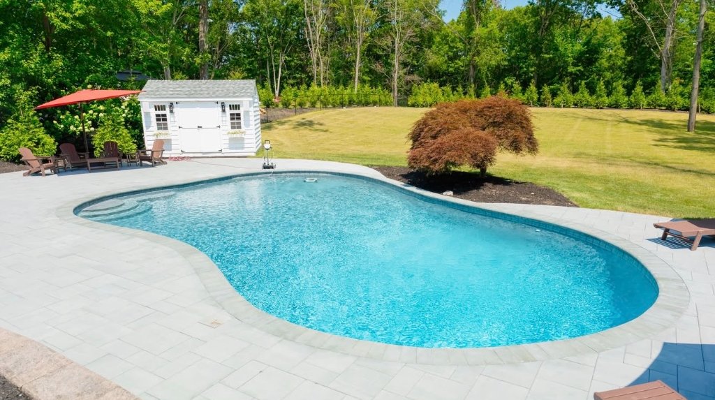 Freeform pool with pool house
