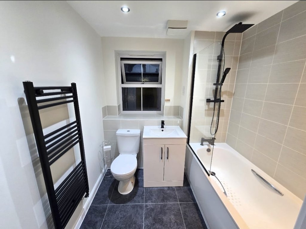 Bathroom with Black Radiator & Shower