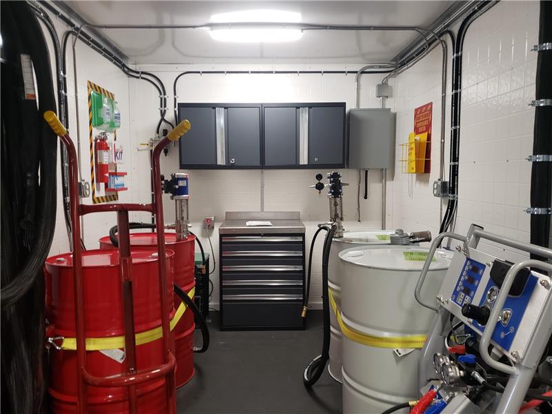 Spray foam chemical drums with transfer pump system and material handling equipment