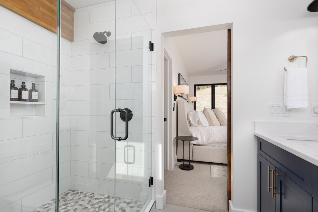 Bathroom 1 — glass walk-in shower with tile