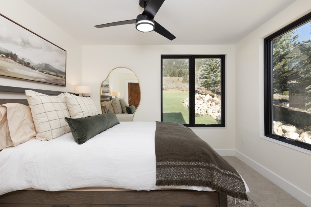 Bedroom 2 — queen bed with garden & mountain views
