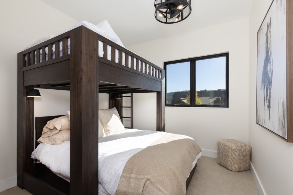 Bedroom 3 — full over queen dark wood bunk beds