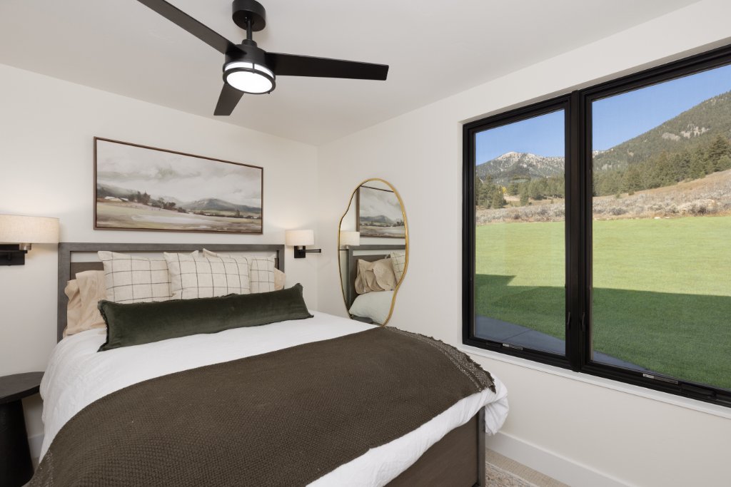Bedroom 2 — queen bed with mountain views
