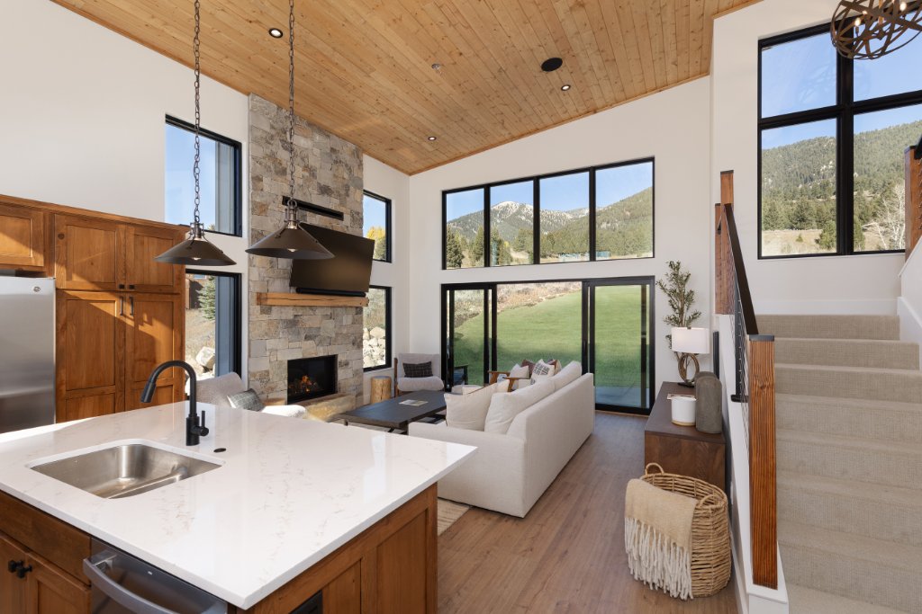 Kitchen — island sink with views to living room & mountains