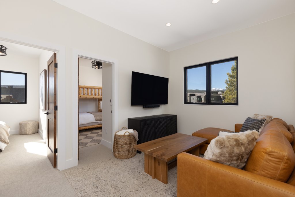 Den — leather sectional with views to bunk rooms