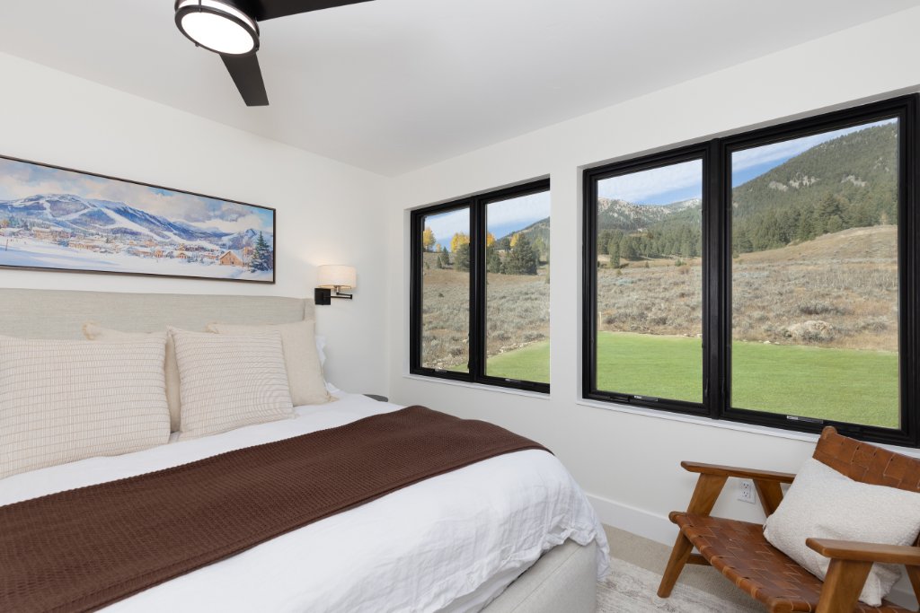 Bedroom 1 — king bed with mountain views