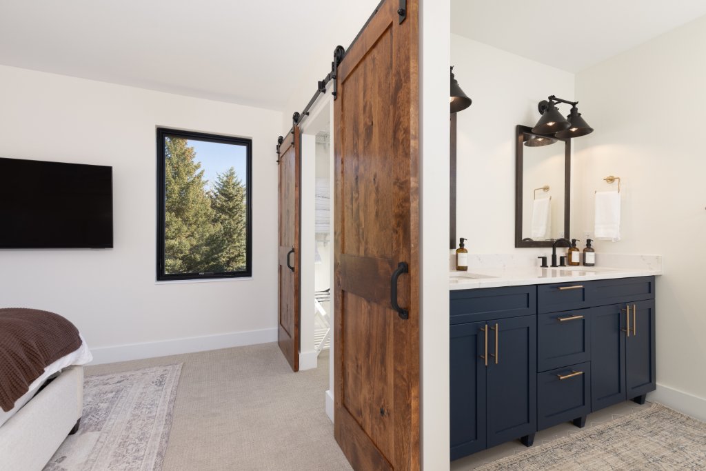 Bathroom 1 — double vanity with barn door entry