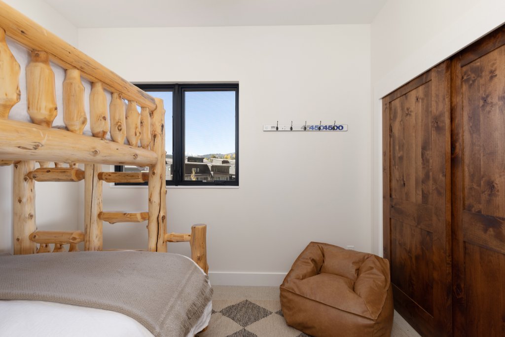 Bedroom 4 — log bunk beds & barn door closet