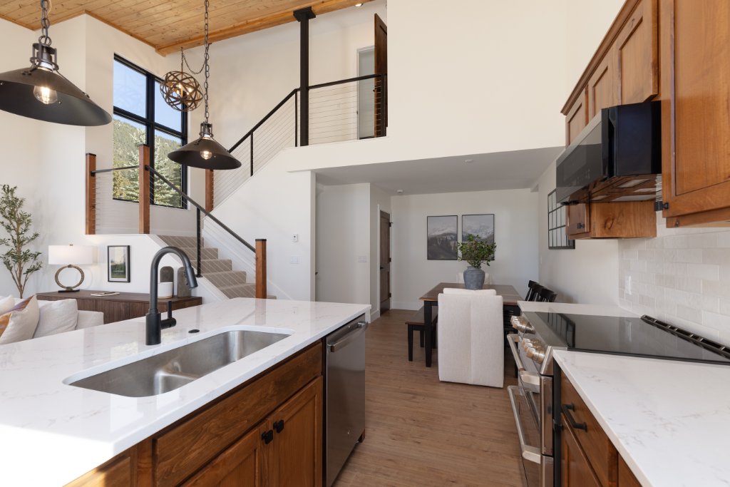 Kitchen — island with pendant lights & open to dining & living areas