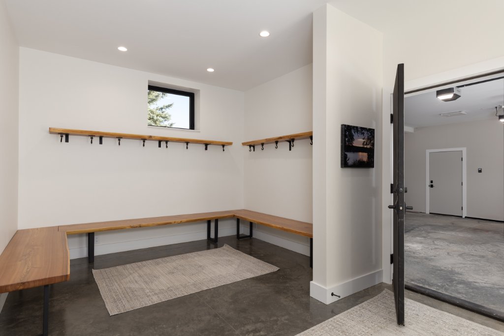 Entryway — mudroom bench, coat hooks & garage access