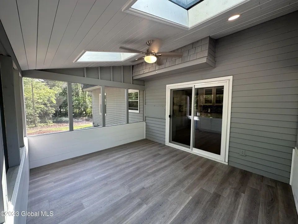 Sunroom & Flooring - Sunroom renovation with new LVP flooring and skylights