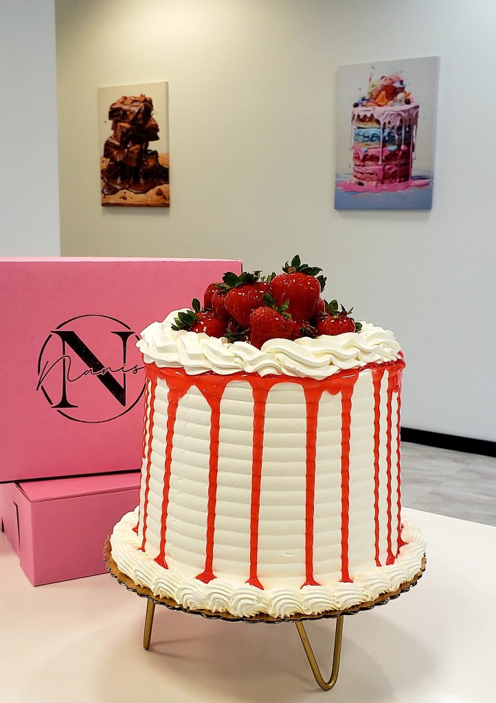 White strawberry drip cake with fresh strawberries on top