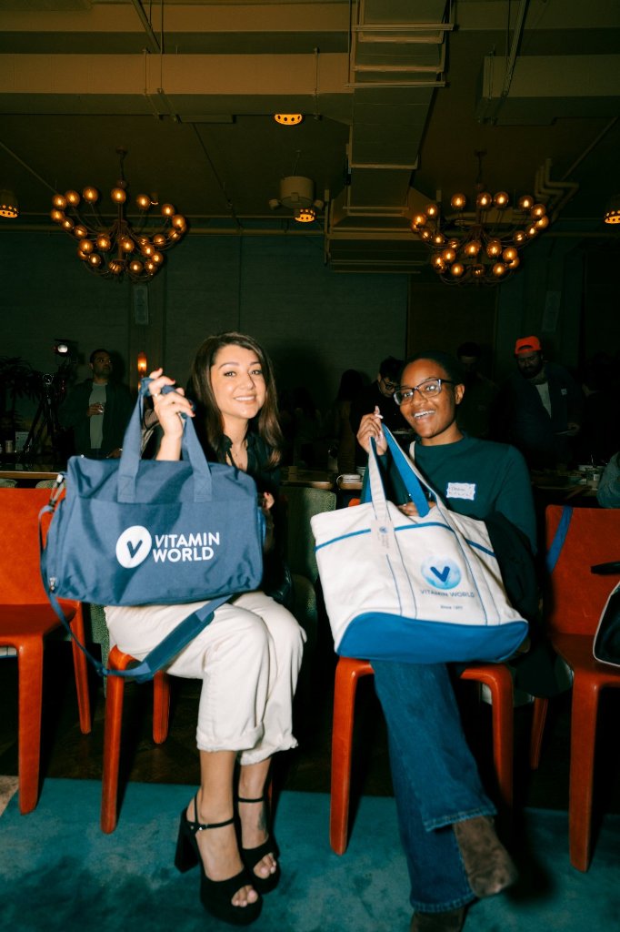Attendees with Vitamin World swag bags