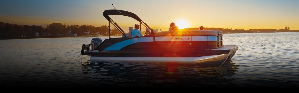 Boat on water at sunset