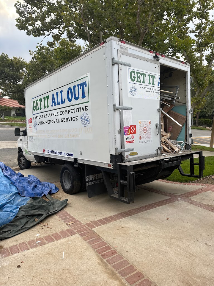Get It All Out Junk branded truck loaded with items for removal in Los Angeles