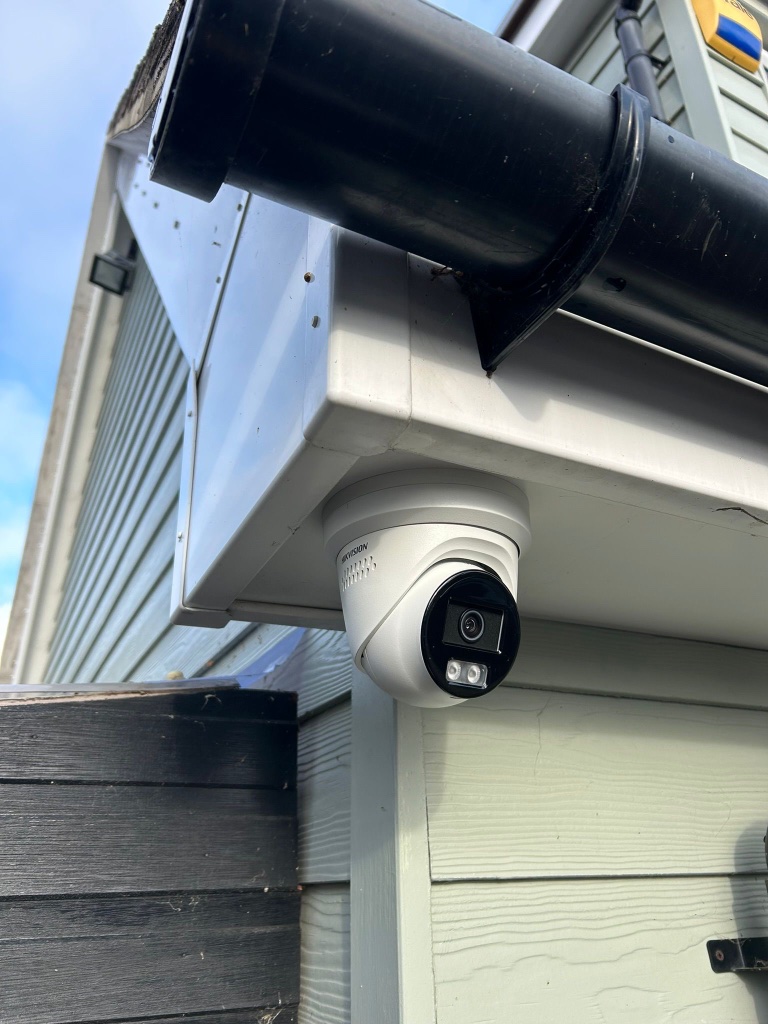 Black CCTV cameras on property