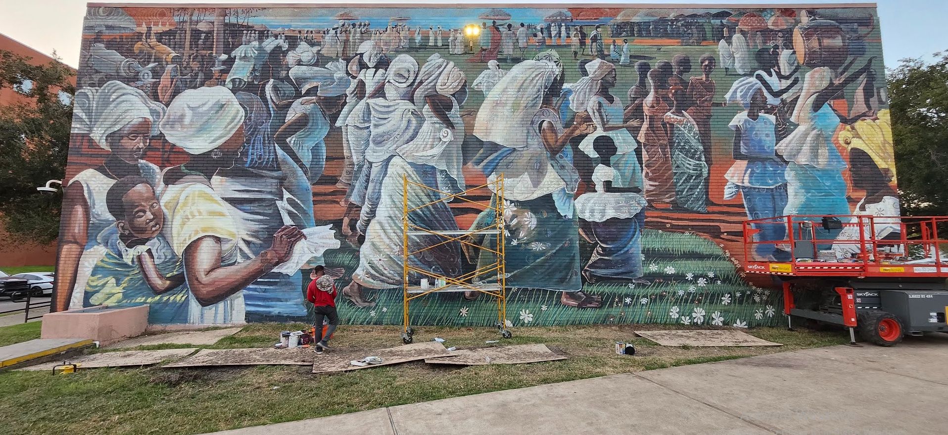 Jubilee, a mural reproduction of John T. Biggers' Jubilee – Ghana Harvest Festival, painted by Adeodunfa with Linda Hinojos