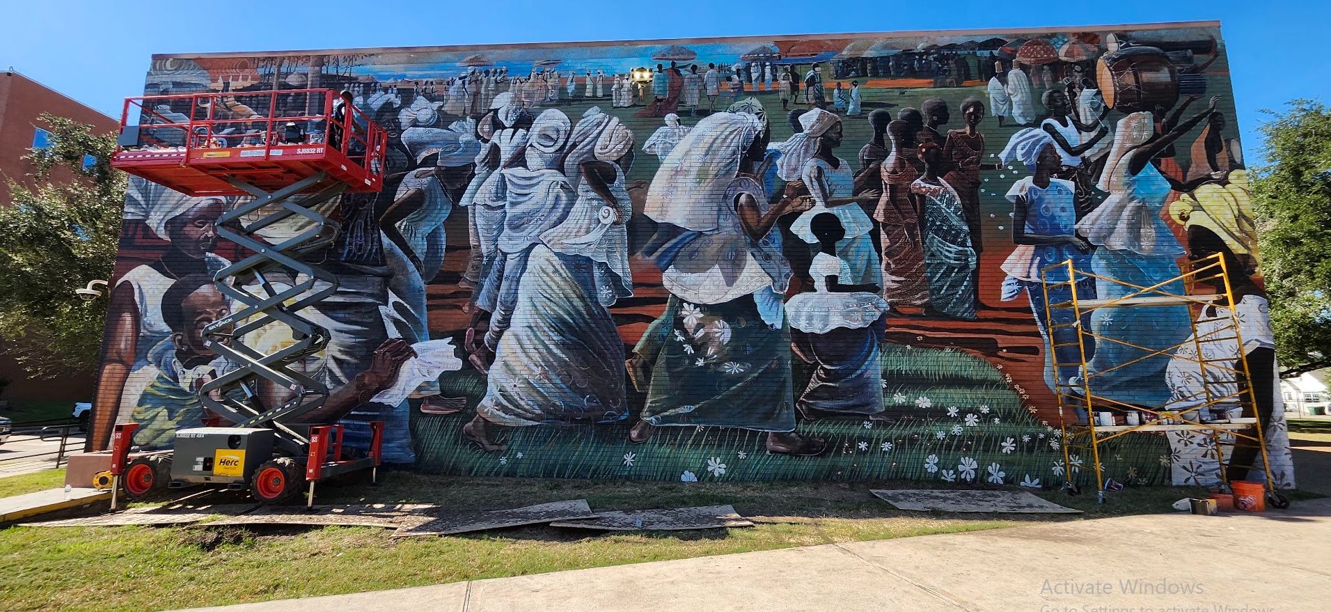 Jubilee, a mural reproduction of John T. Biggers' Jubilee – Ghana Harvest Festival, painted by Adeodunfa with Linda Hinojos
