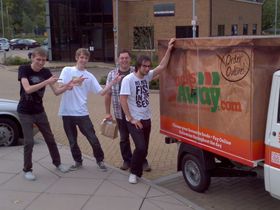 Four lads posing and pointing at the Snacks Away van